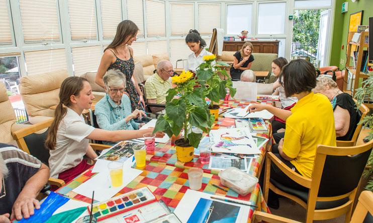 A Paints Pals party with schoolchildren and people with dementia.