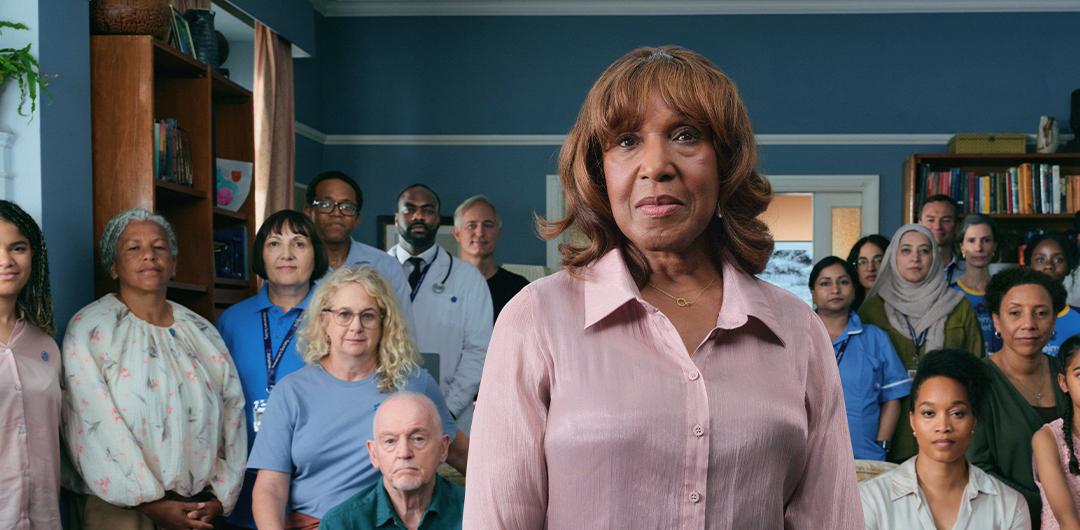 A diverse room of people representing different careers and backgrounds, including nurses, doctors and members of the public.