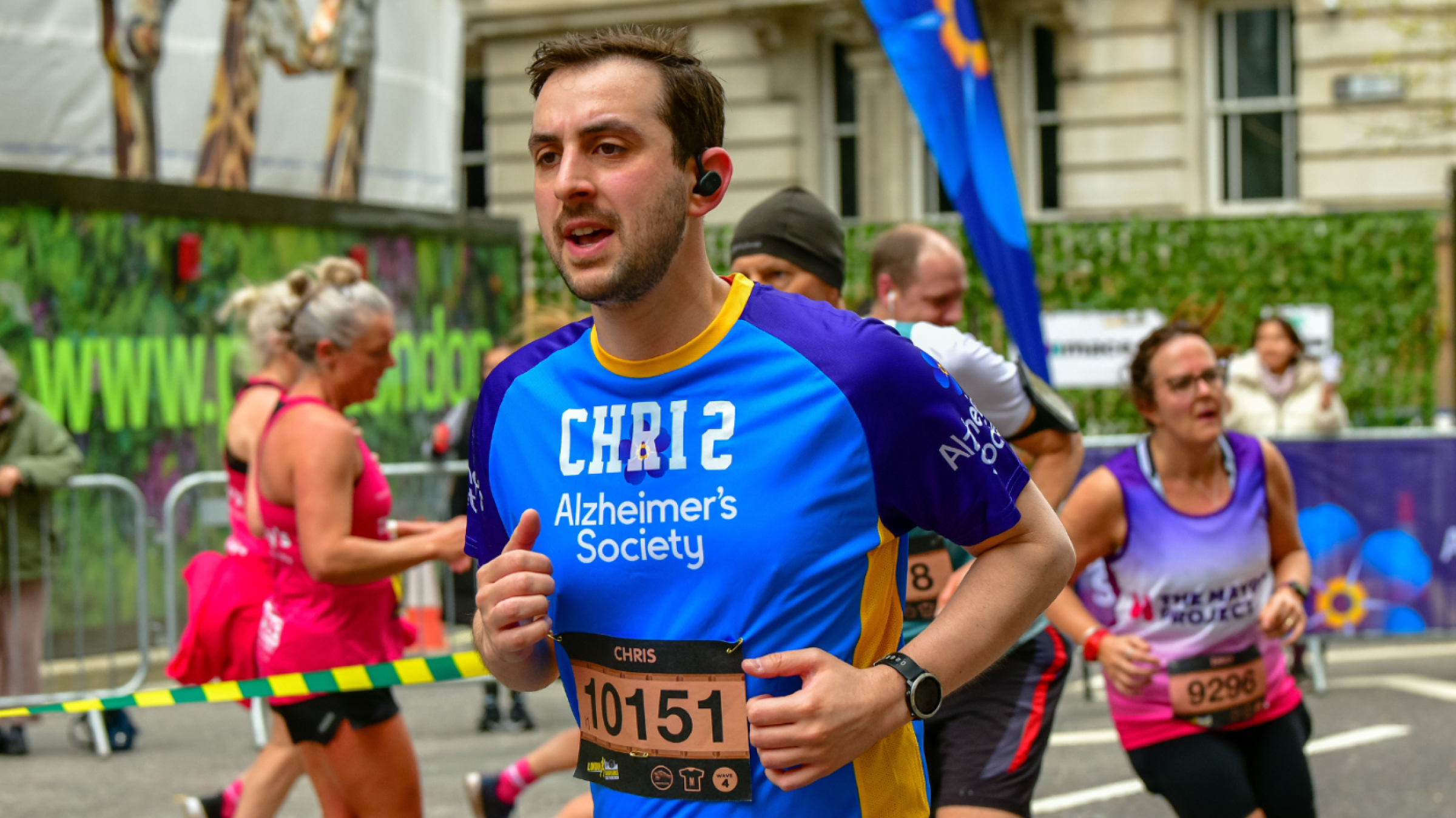 Alzheimer's Society runner surrounded by other runners