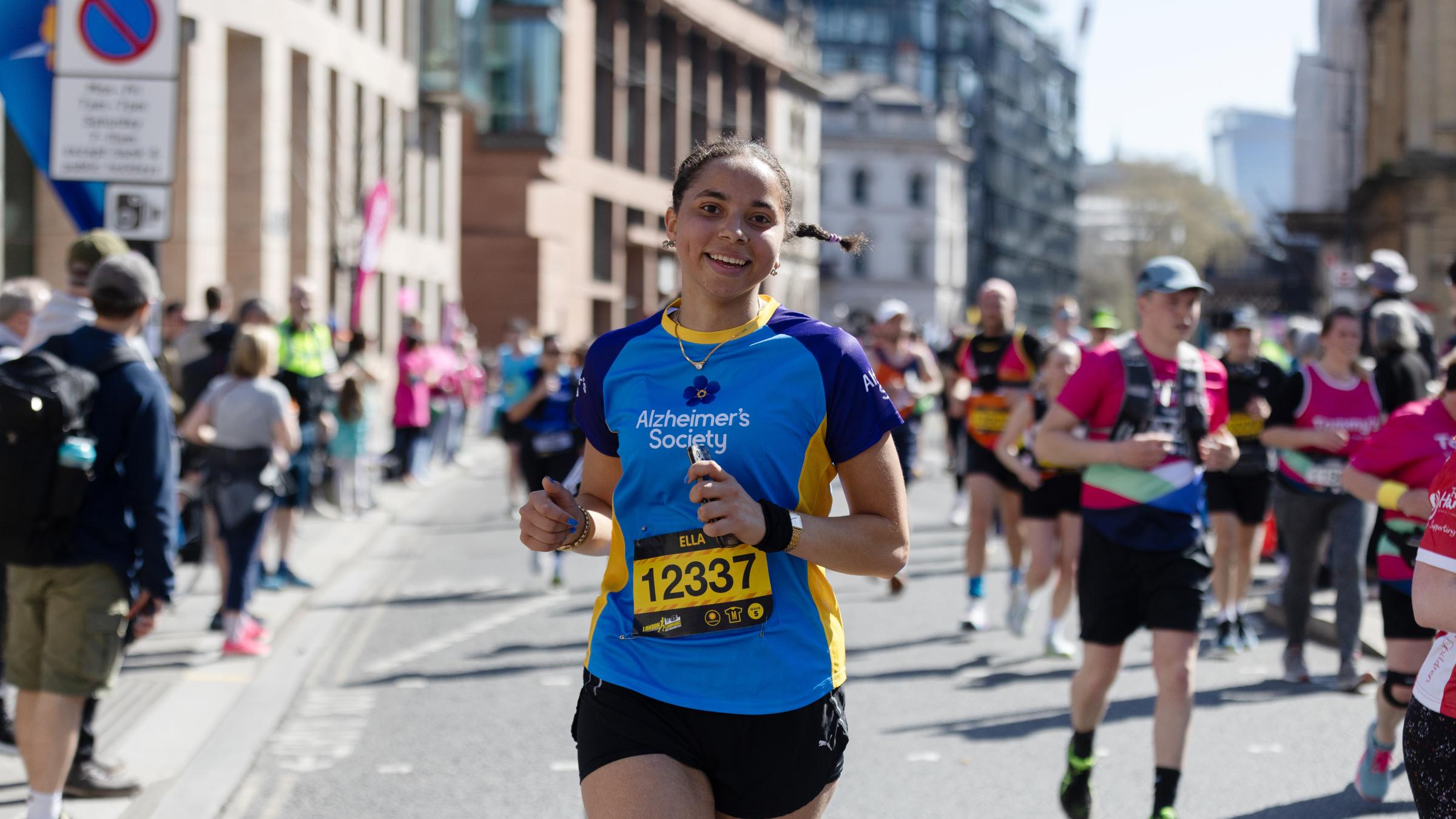 Woman running in Alzheimer's Society top