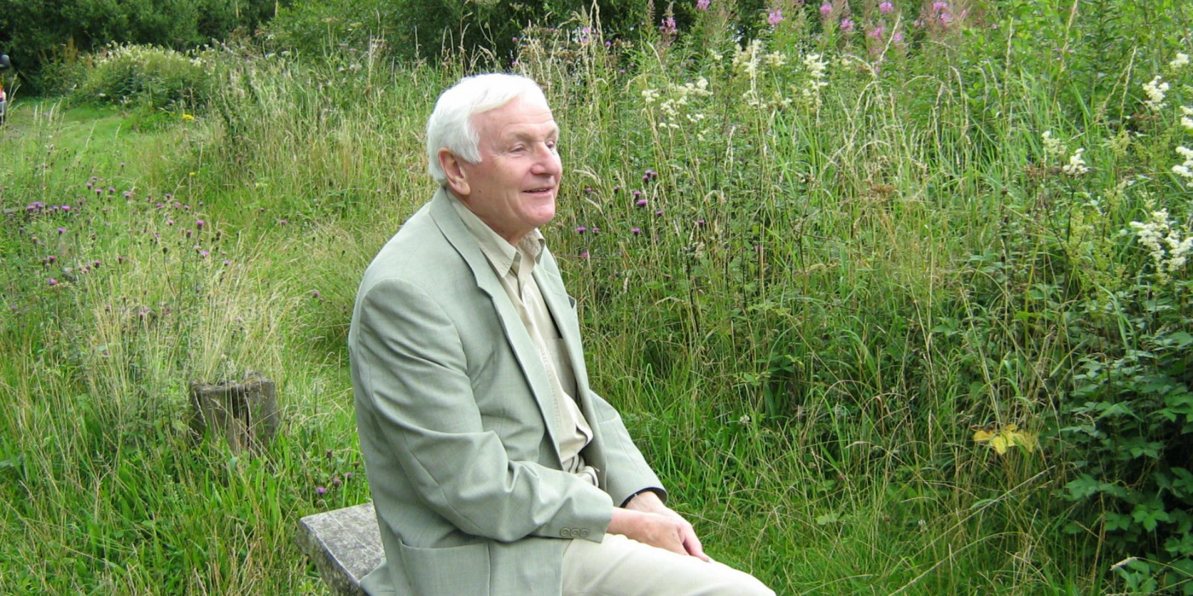 Sylvie's Grandad Owl sitting on a bench