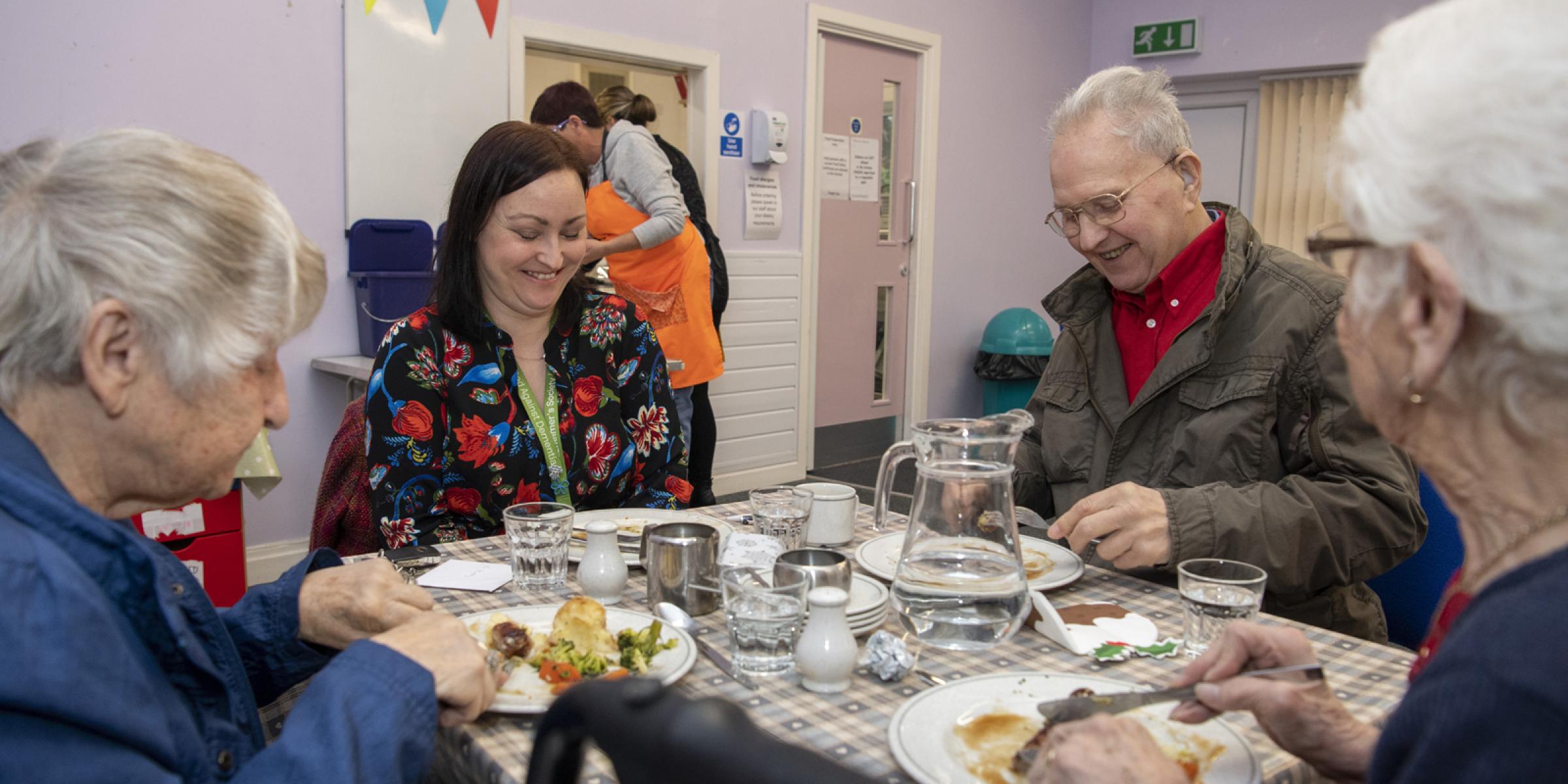 People with dementia eating lunch at the Salvation Army