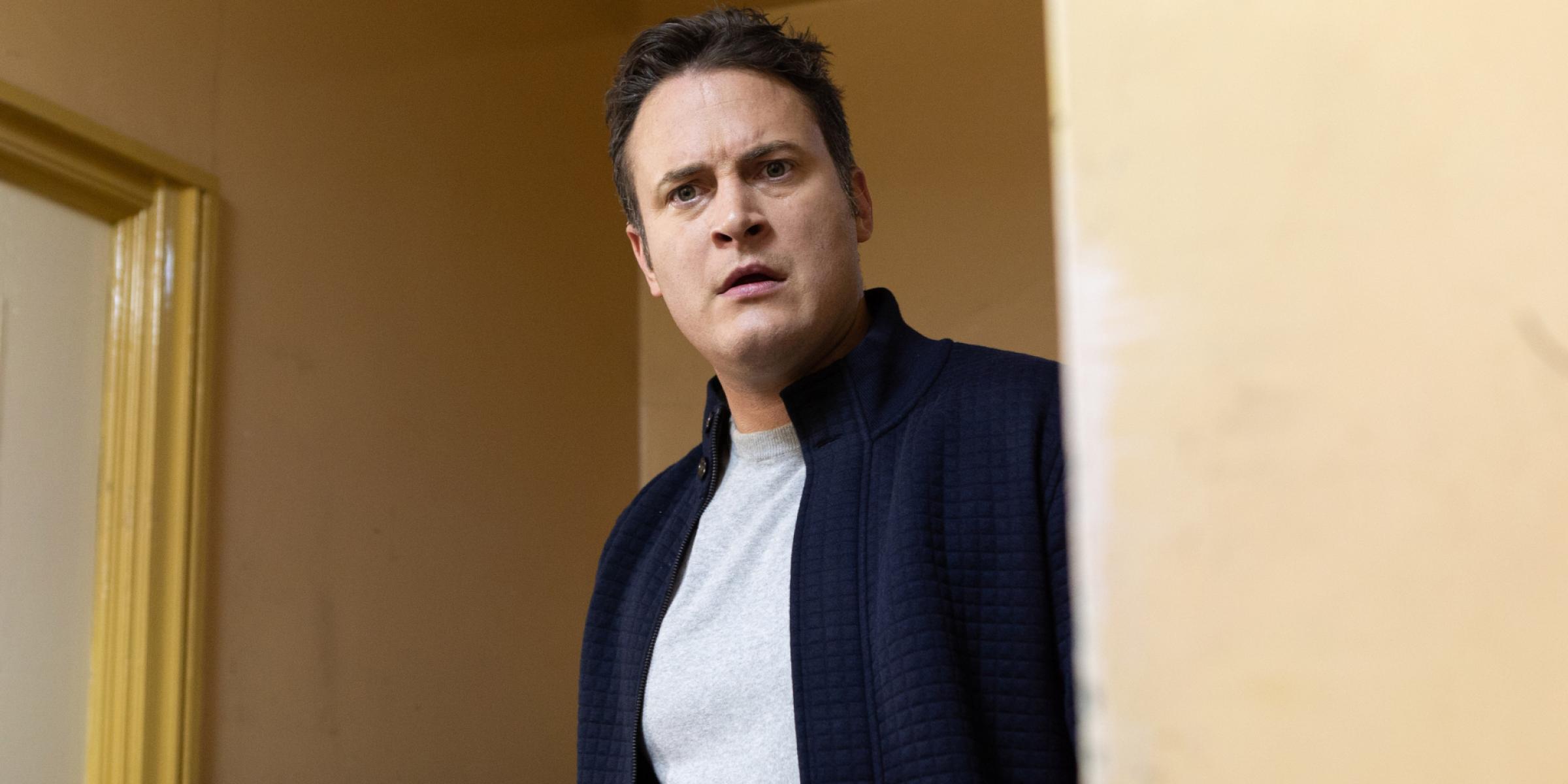 Luke Morgan, a character from Hollyoaks, looks on in shock