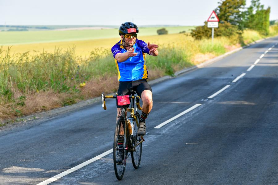Single guy cycling in the countryside