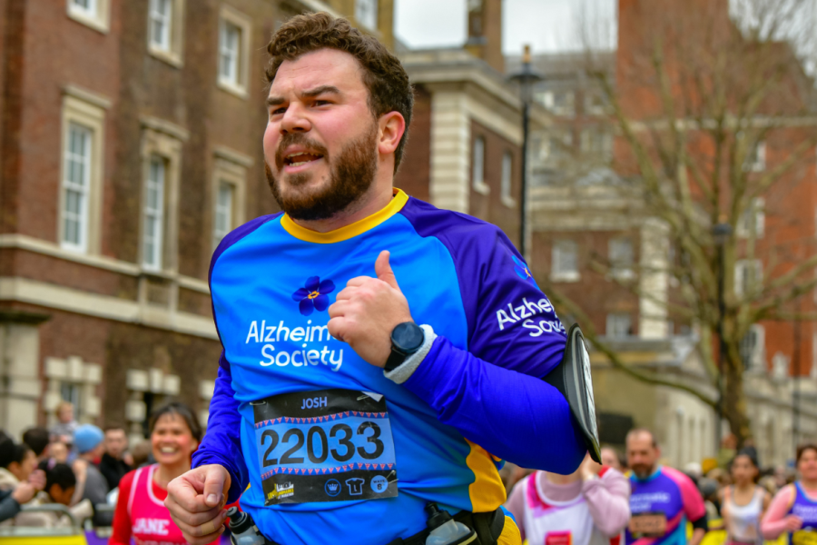 Man running in Alzheimer's Society branded top