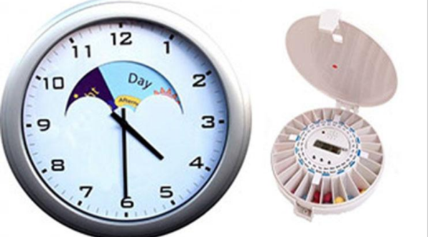 Day and night clock and pill despenser