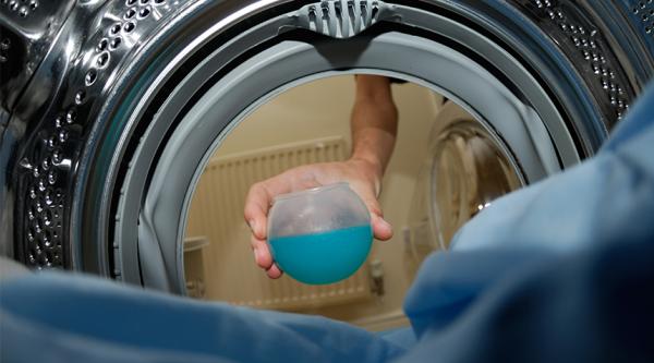 Putting a load of washing on