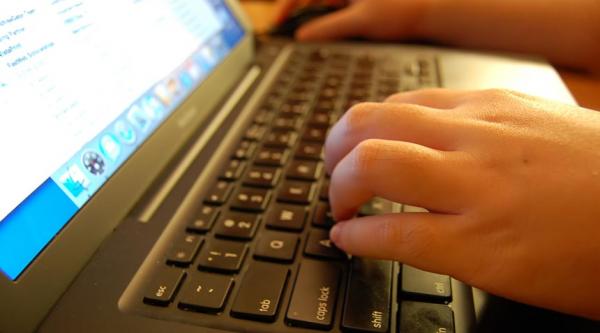 Someone using a computer keyboard
