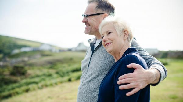 Couple with an arm around each other
