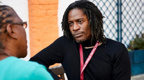 Moise Roche listening to a research participant
