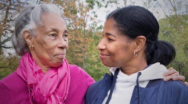 A close-up of Daphne with an arm around her daughter, Michelle