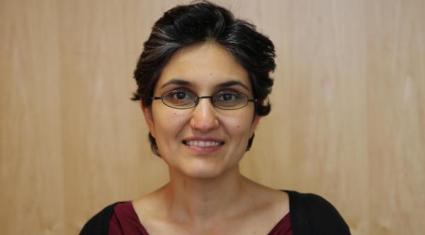Dr Naaheed Mukadam is facing the viewer straight on and smiling