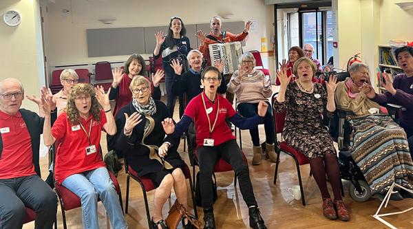 A group enjoys a Lost Chord session. They pose for a picture.