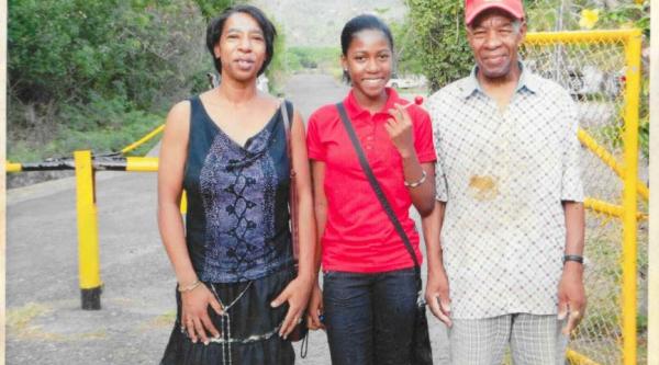 Rianna (centre) stands with her grandad (right)