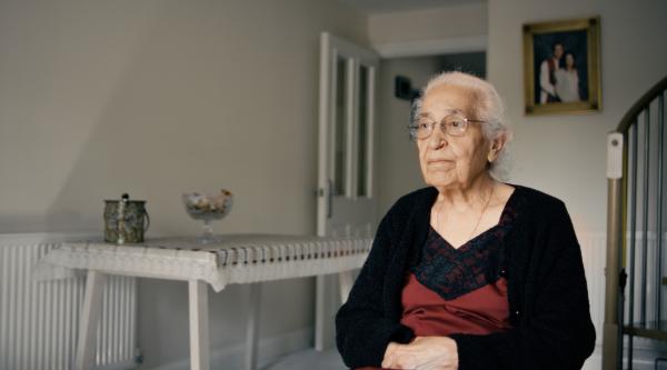 A woman sat with her arms folded