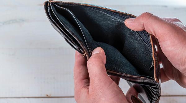 A pair of hands holding an empty open wallet. Photograph: Marco Verch Flickr 