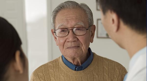 Person looking at two healthcare professionals