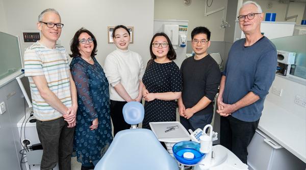 Chenyi and Jing (third and fourth from left) with their team.