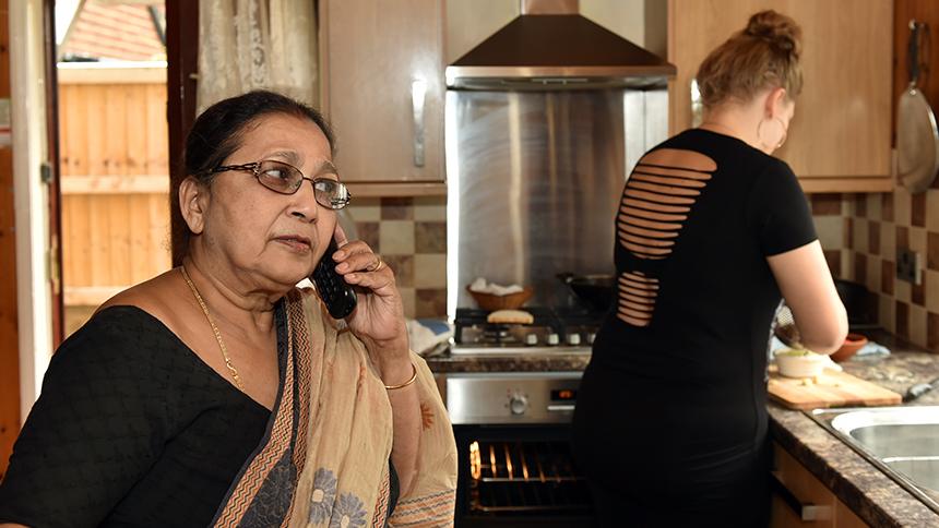 Anima Bhuiya at home with homecare worker Sarah.