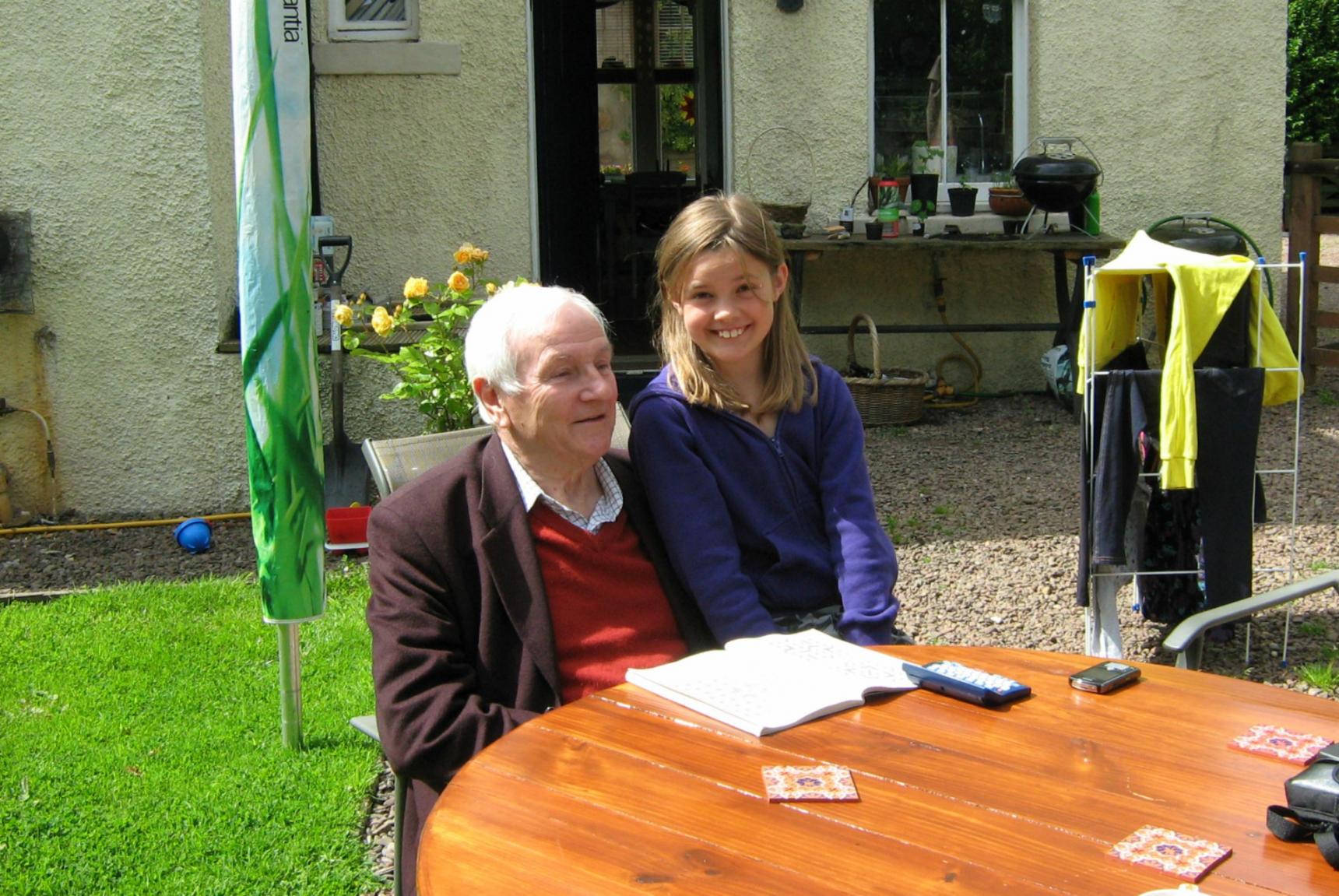 Sylvie with Grandad Owl in the garden