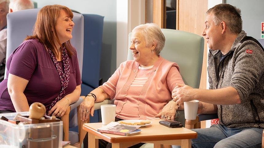 Staff and group members chat at the Northern Ireland Hospice Dementia Wellbeing Clinic