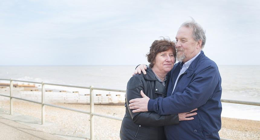Man and woman hugging on the beach