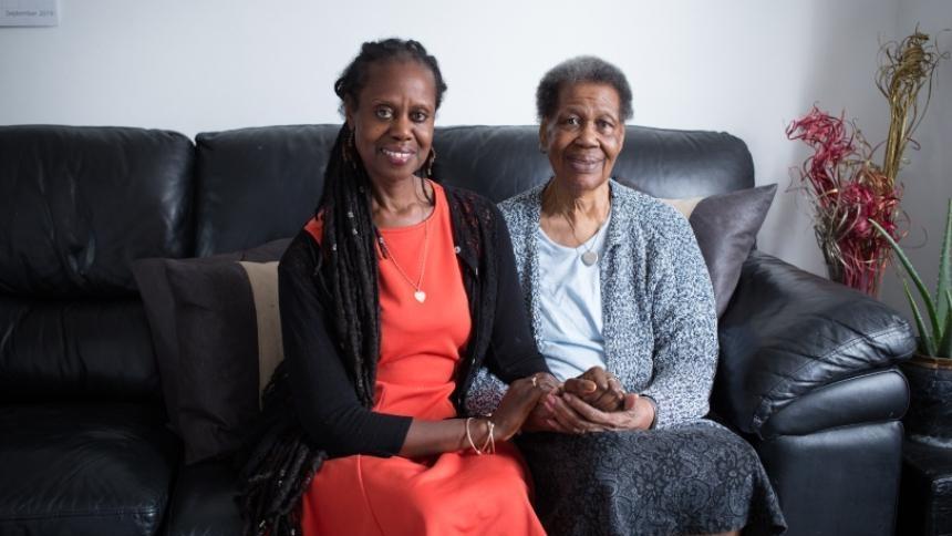 Enomwoyi and Pearl together on the sofa