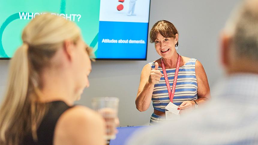 Someone presenting at an Alzheimer's Society training course.