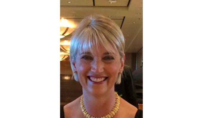 A close up photo of Hazel at an event, smiling