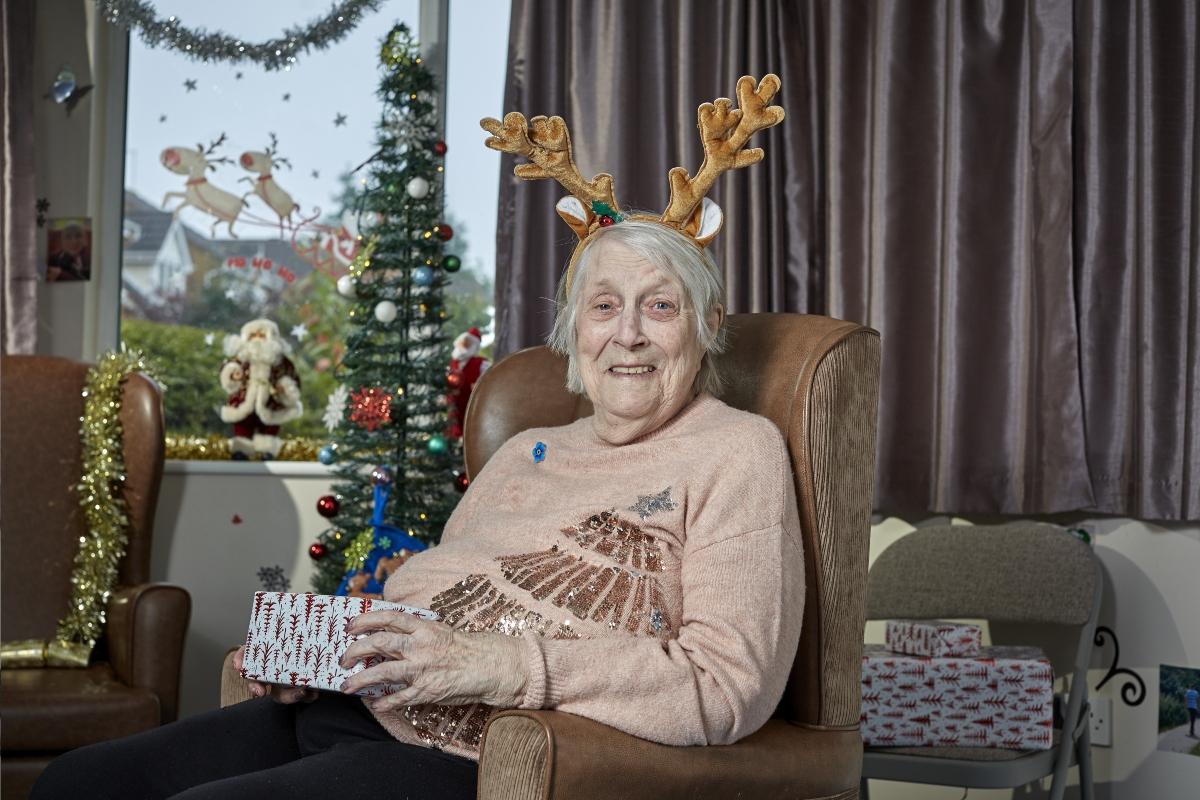 Service user Doreen wearing Christmas antlers