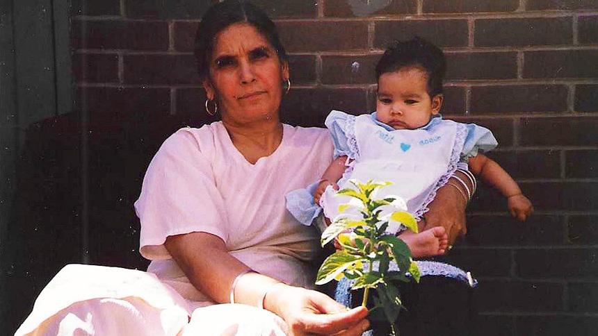 Nani Ji holds Kiran Kaur Barn as a baby
