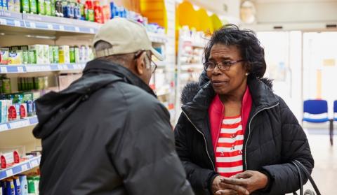 A man and a woman in a pharmacy