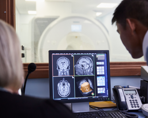 Elijah Mak looking at a scan onscreen