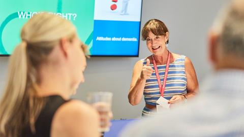 Someone presenting at an Alzheimer's Society training course.