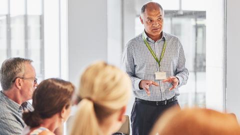 Someone speaking at an Alzheimer's Society training course.