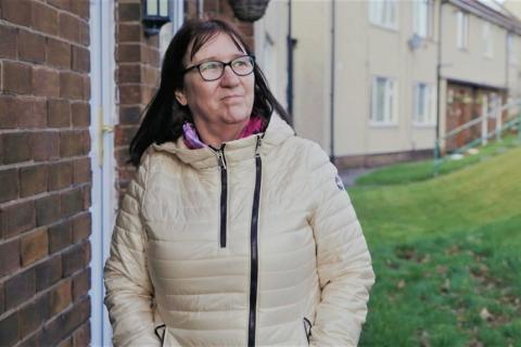 A woman walking around her local area