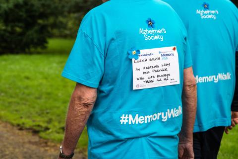 'In Memory' sign on back of t-shirt
