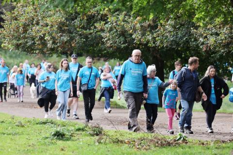 People in blue t-shirts walking for the Memory Walk