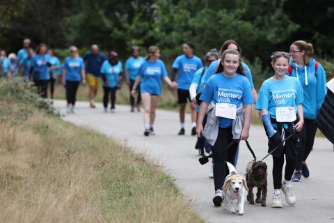 Memory Walkers coming around the corner in Sutton Park with their dogs